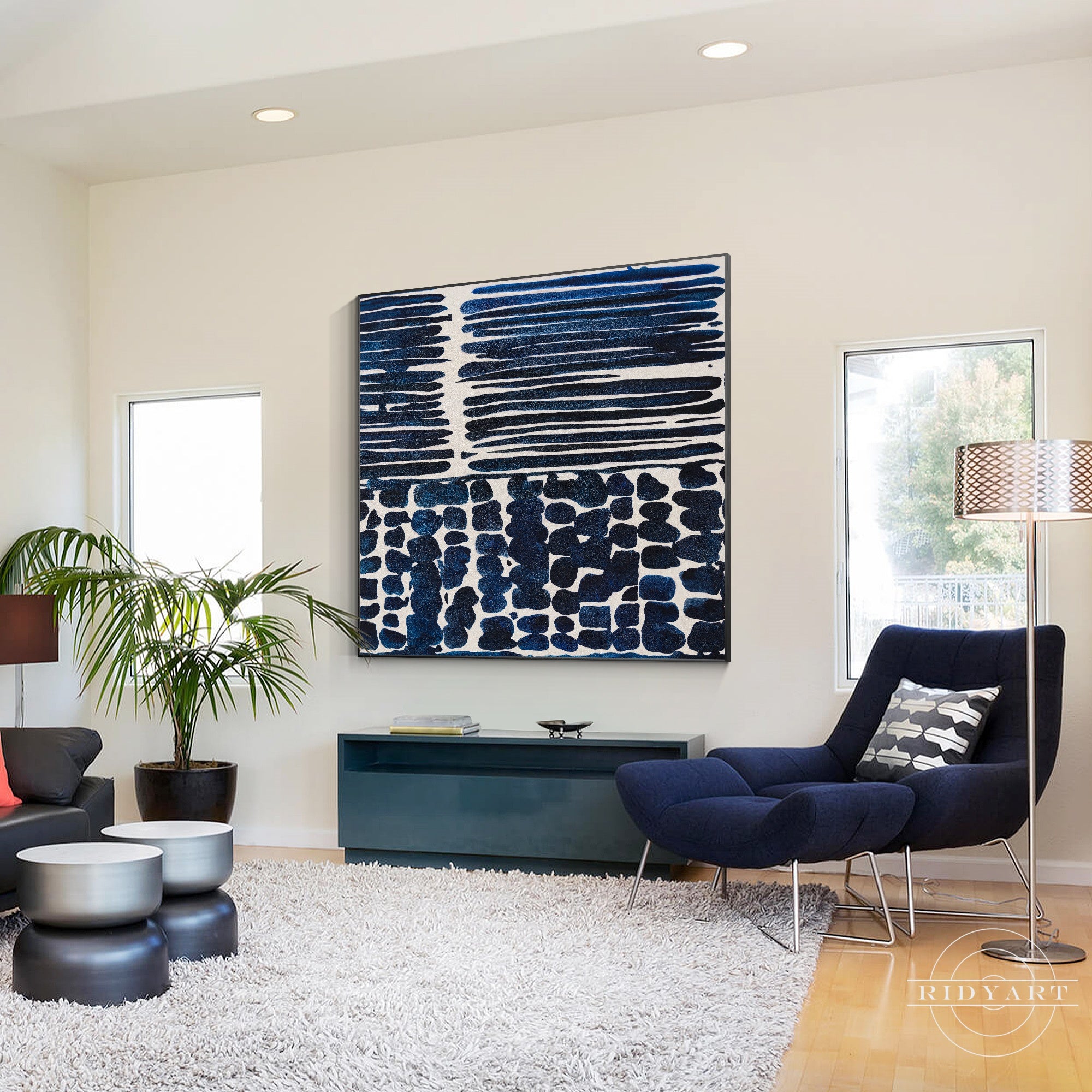 Navy blue textured abstract painting on canvas, framed wall art.
