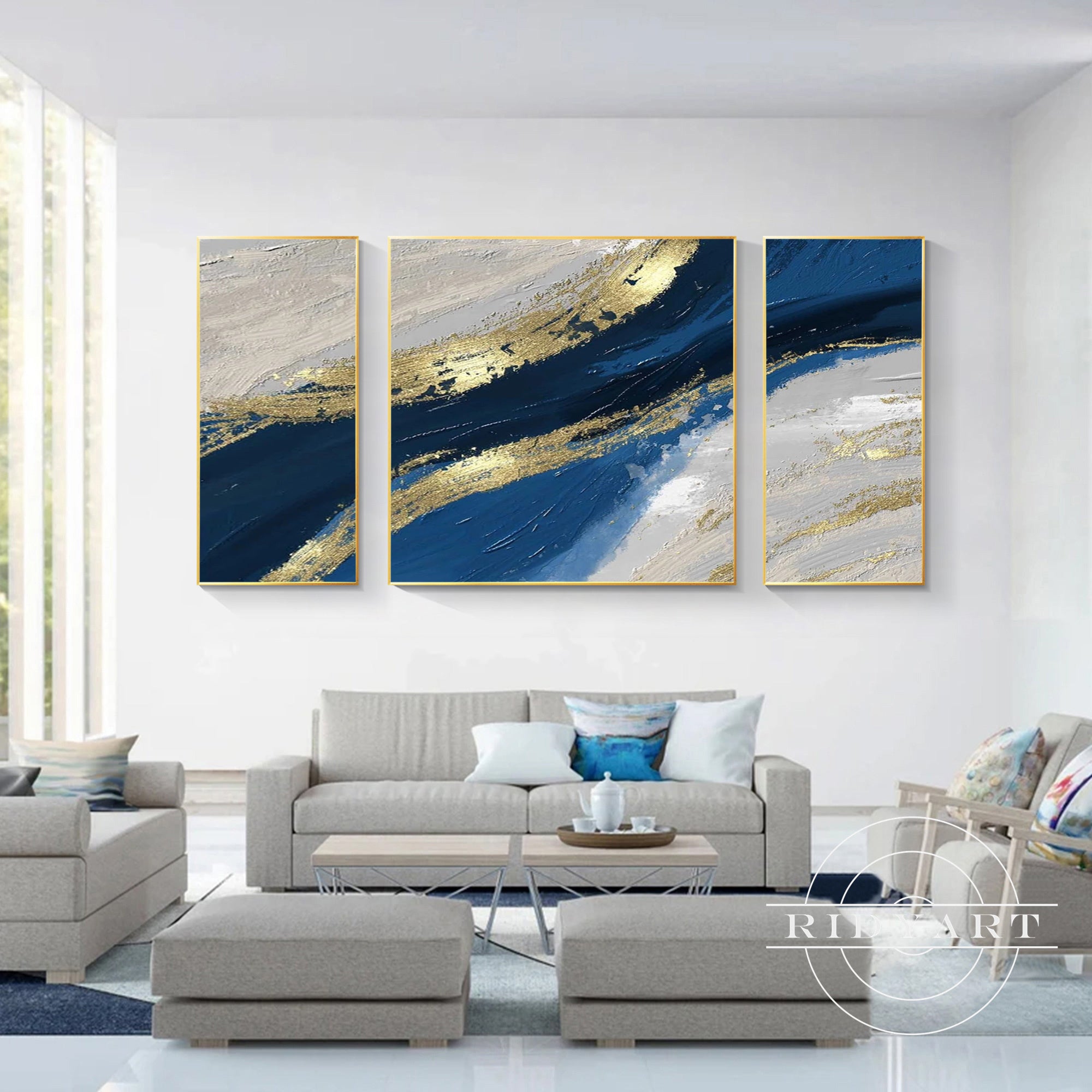 Three-panel abstract wall decor in blue, gold, and white hues.