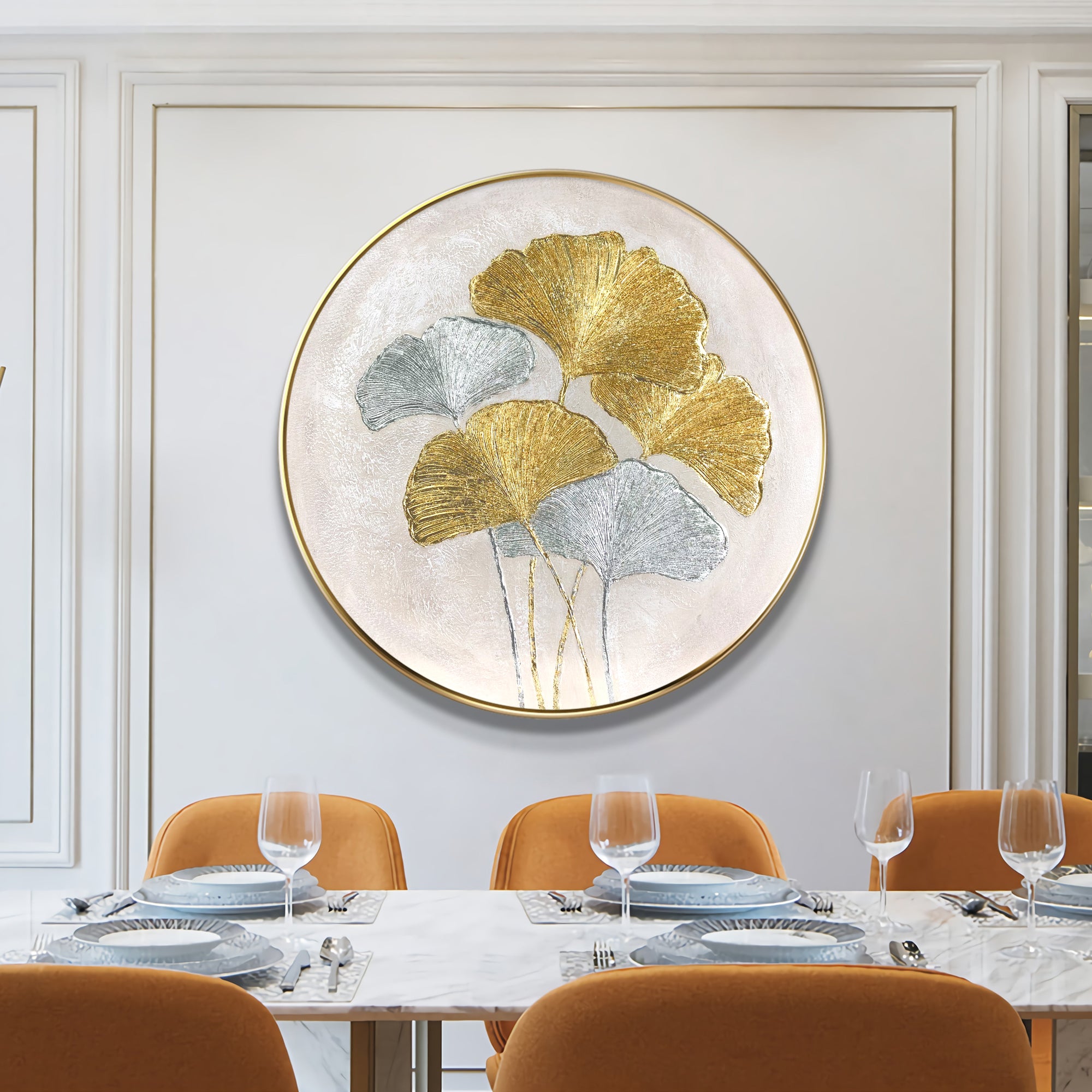 Ginkgo leaves painting featuring gold and silver foil accents. Round textured minimalist wall art for elegant and luxurious interior design.

