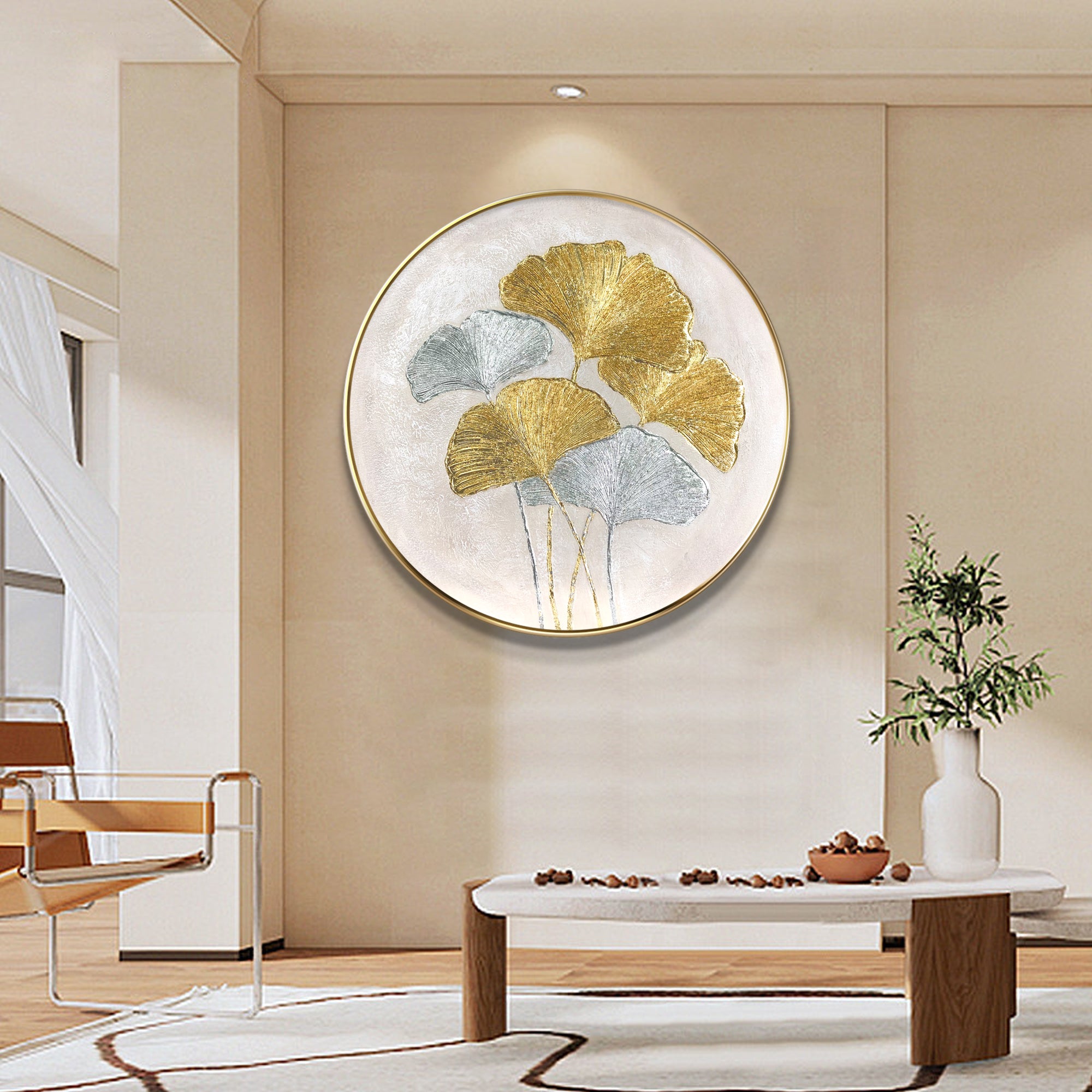 Ginkgo leaves painting featuring gold and silver foil accents. Round textured minimalist wall art for elegant and luxurious interior design.

