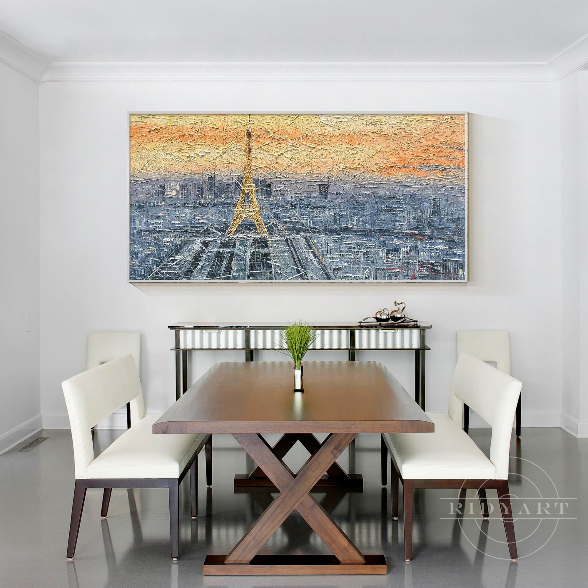 Hand-painted Eiffel Tower wall art with a sunset backdrop