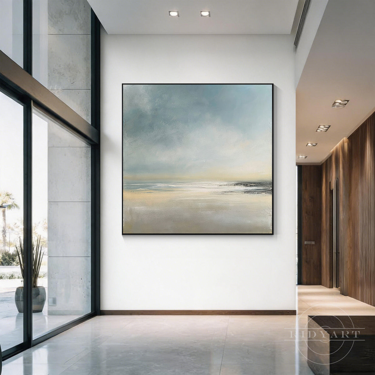 Close-up view of blended oil impasto brushstrokes showing soft sky blue, warm beige, and shimmering ocean light textures on canvas.