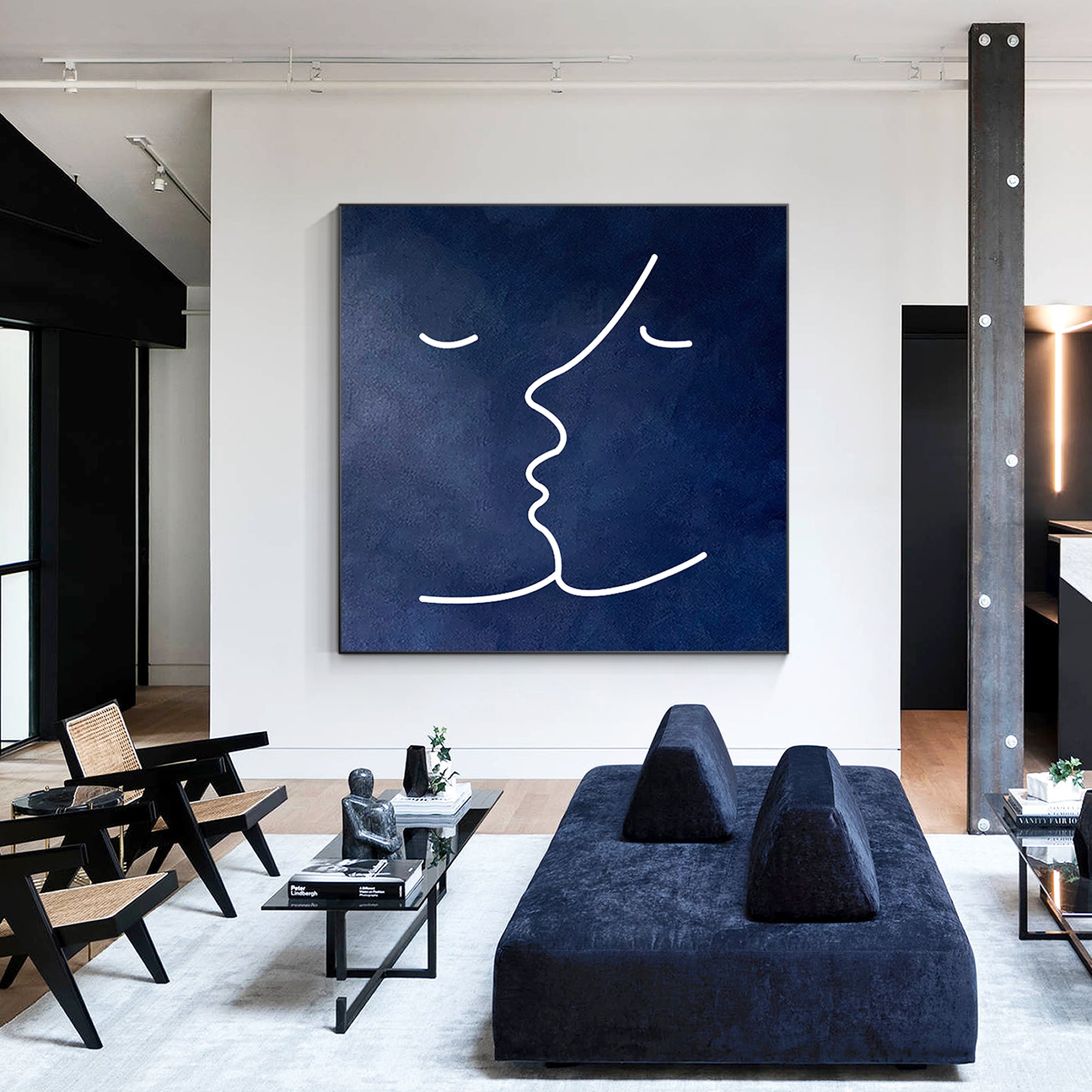 Minimalist navy blue wall art with a white abstract line drawing of a face