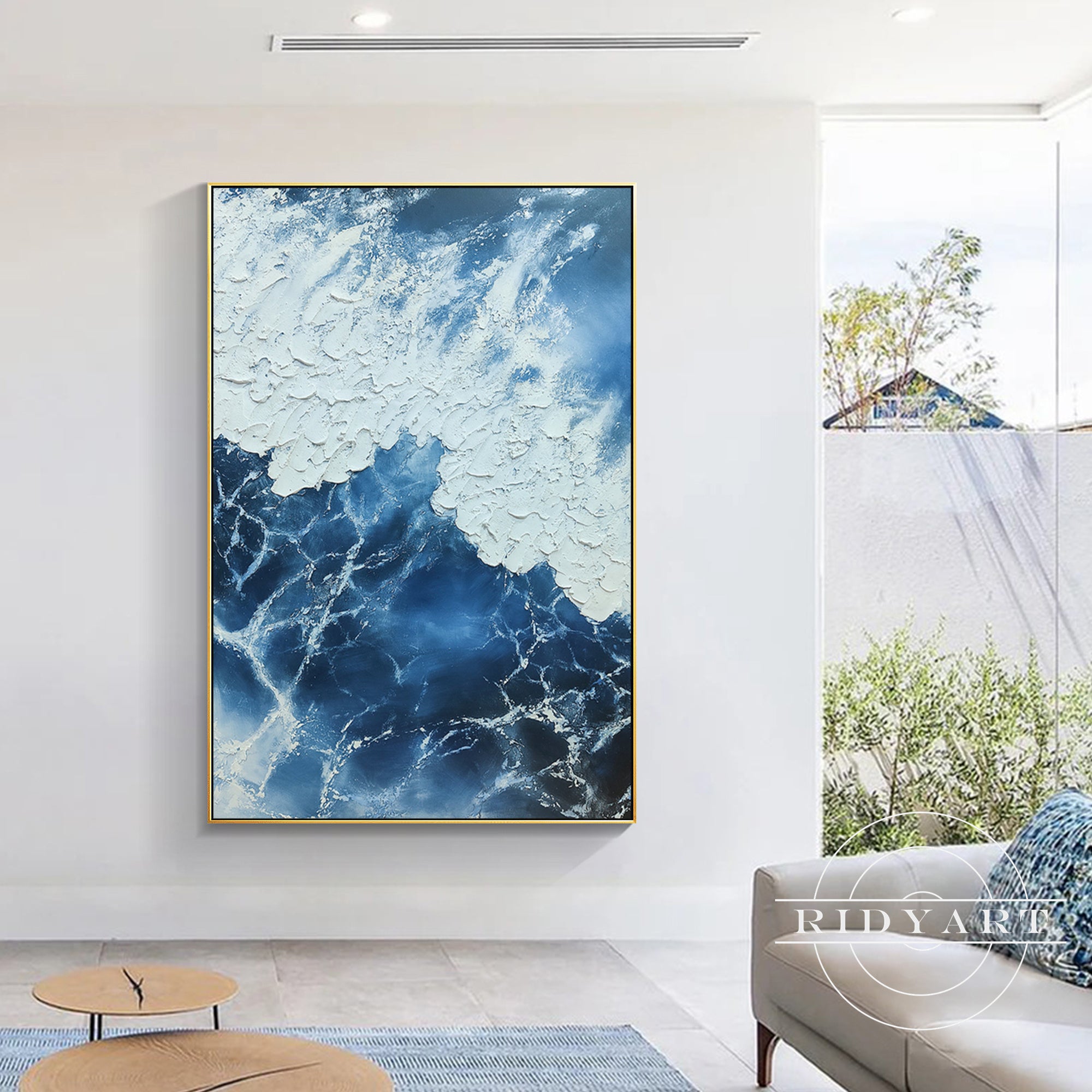 Abstract navy blue ocean painting with white textured brushstrokes.