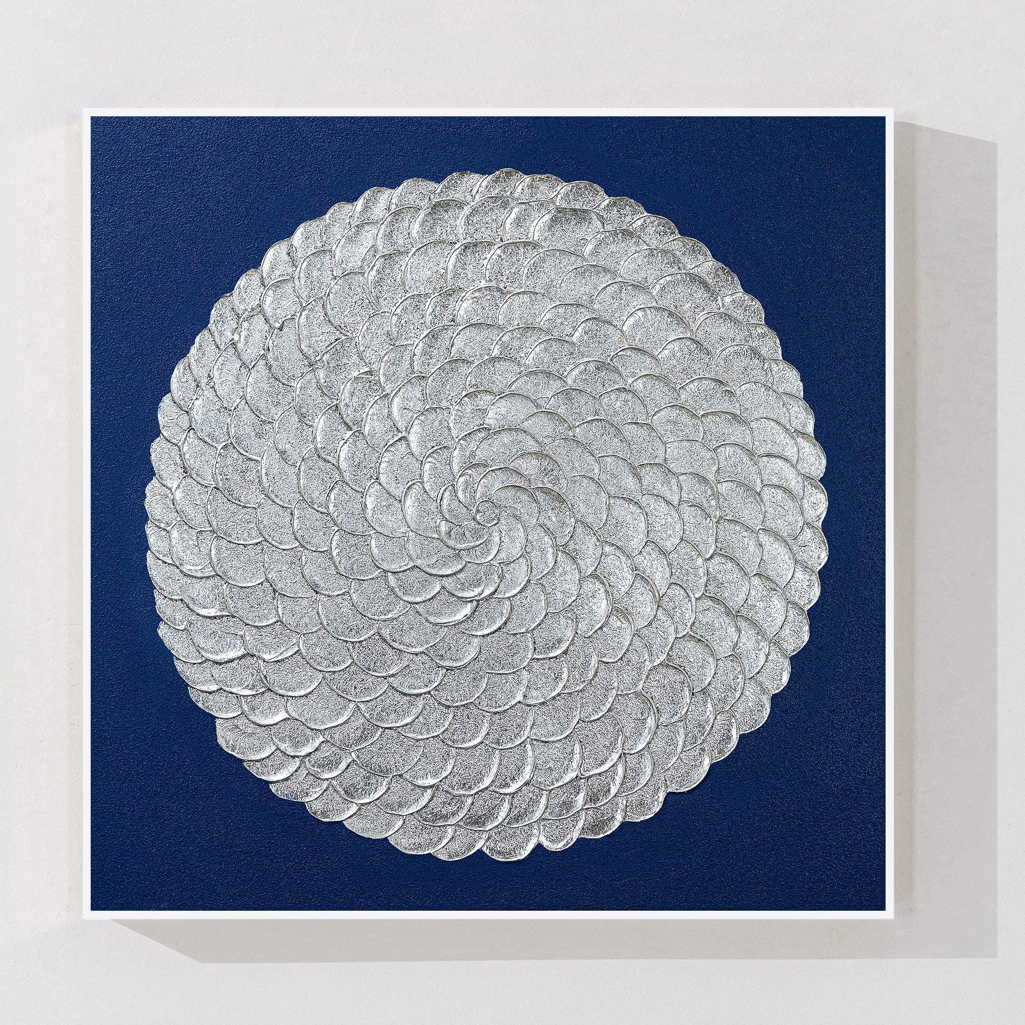 Navy blue and silver leaf abstract wall art with textured circle