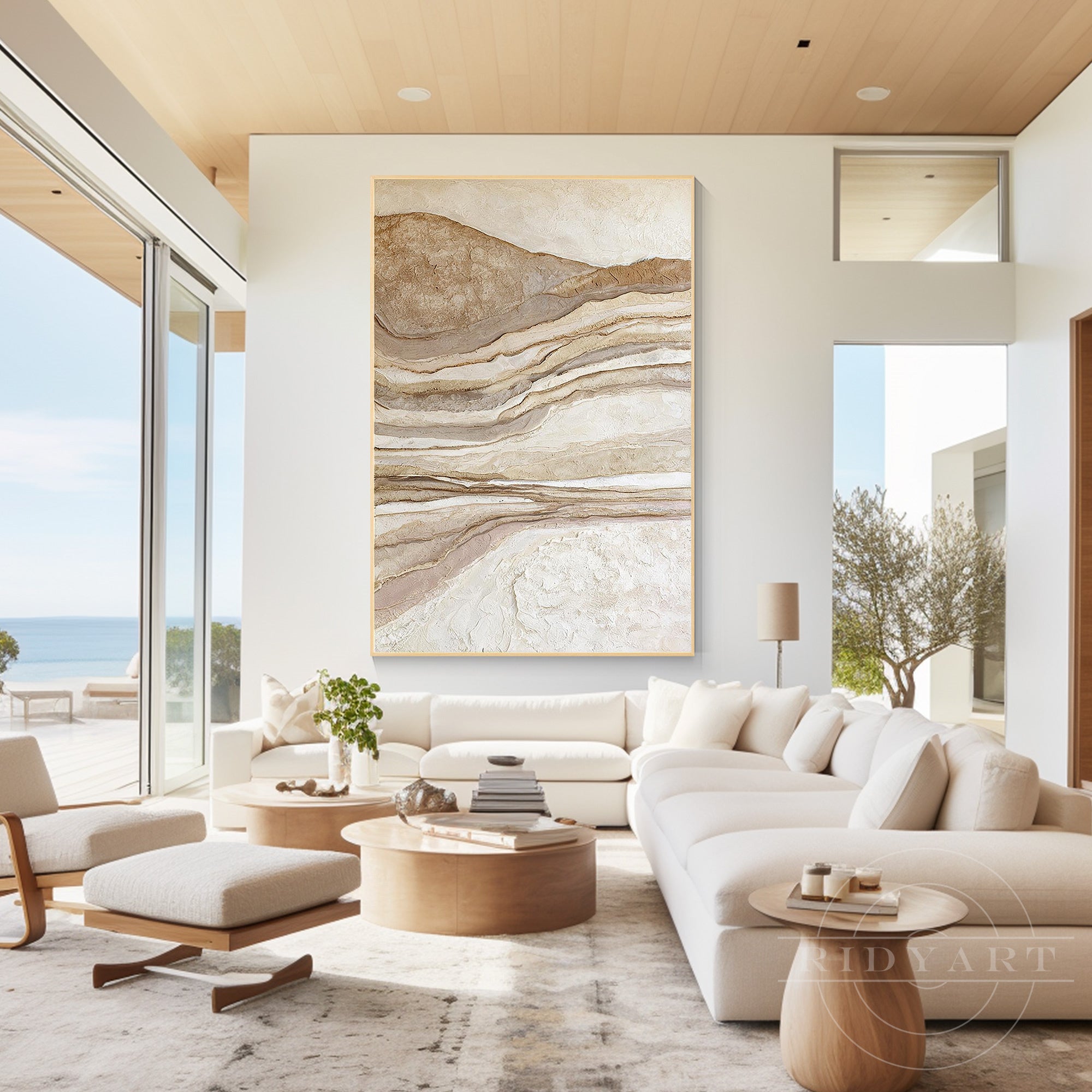 Neutral-toned 3D textured abstract canvas artwork displayed over a modern living room sofa in a minimalist warm interior design style.