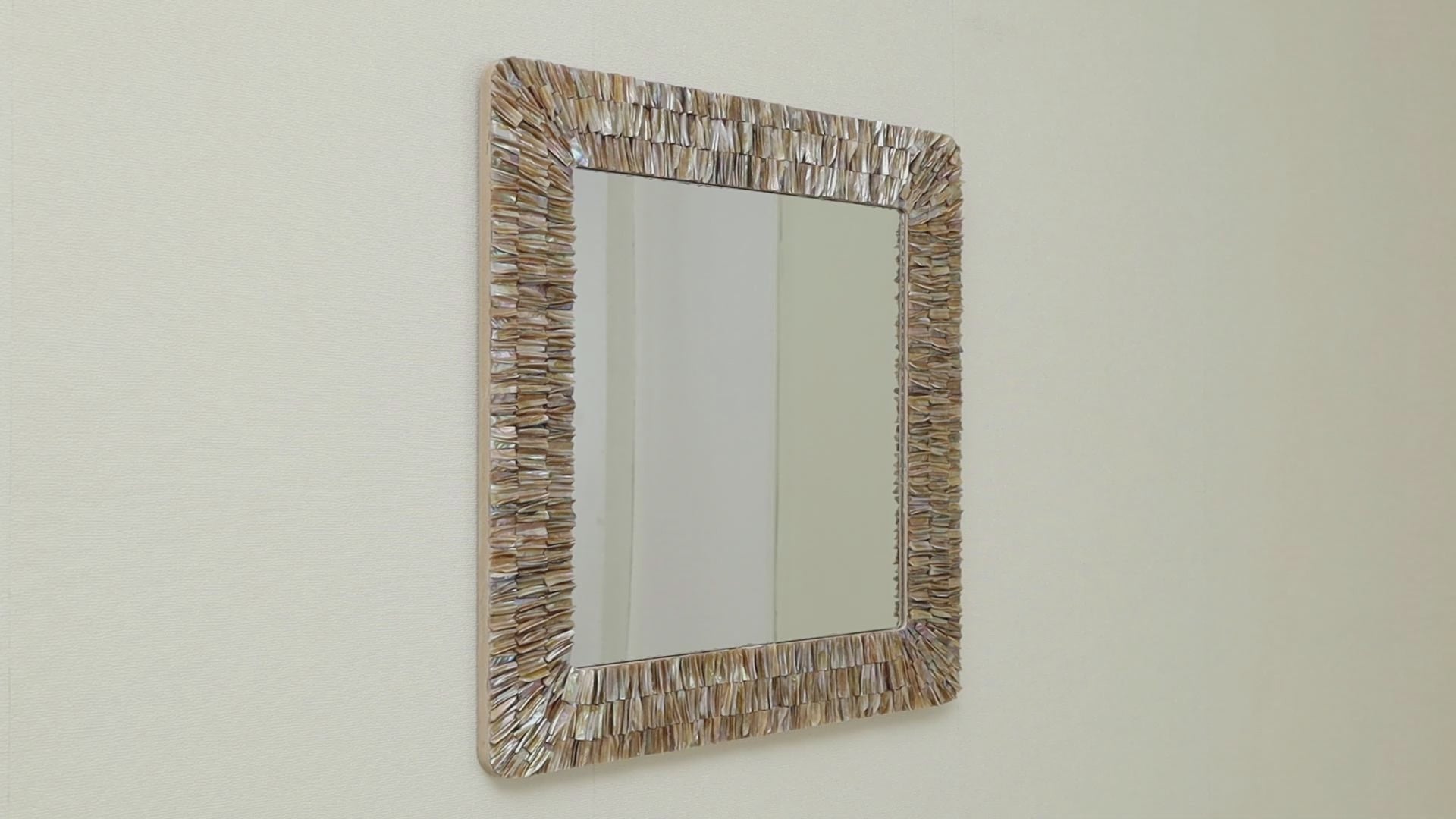 Unique mirror frame adorned with natural seashells, perfect for beach homes.