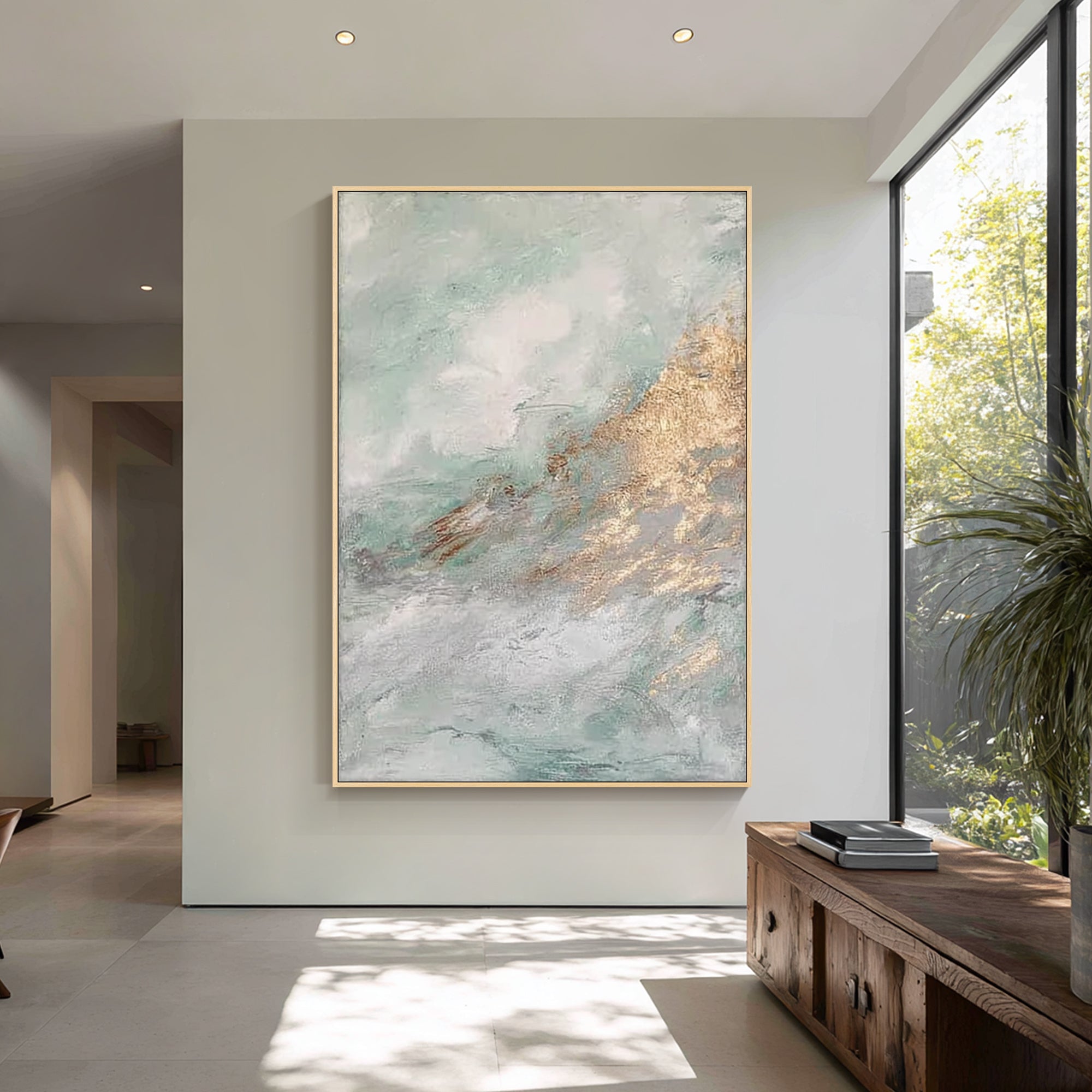 sage green abstract wall art above sofa in modern living room