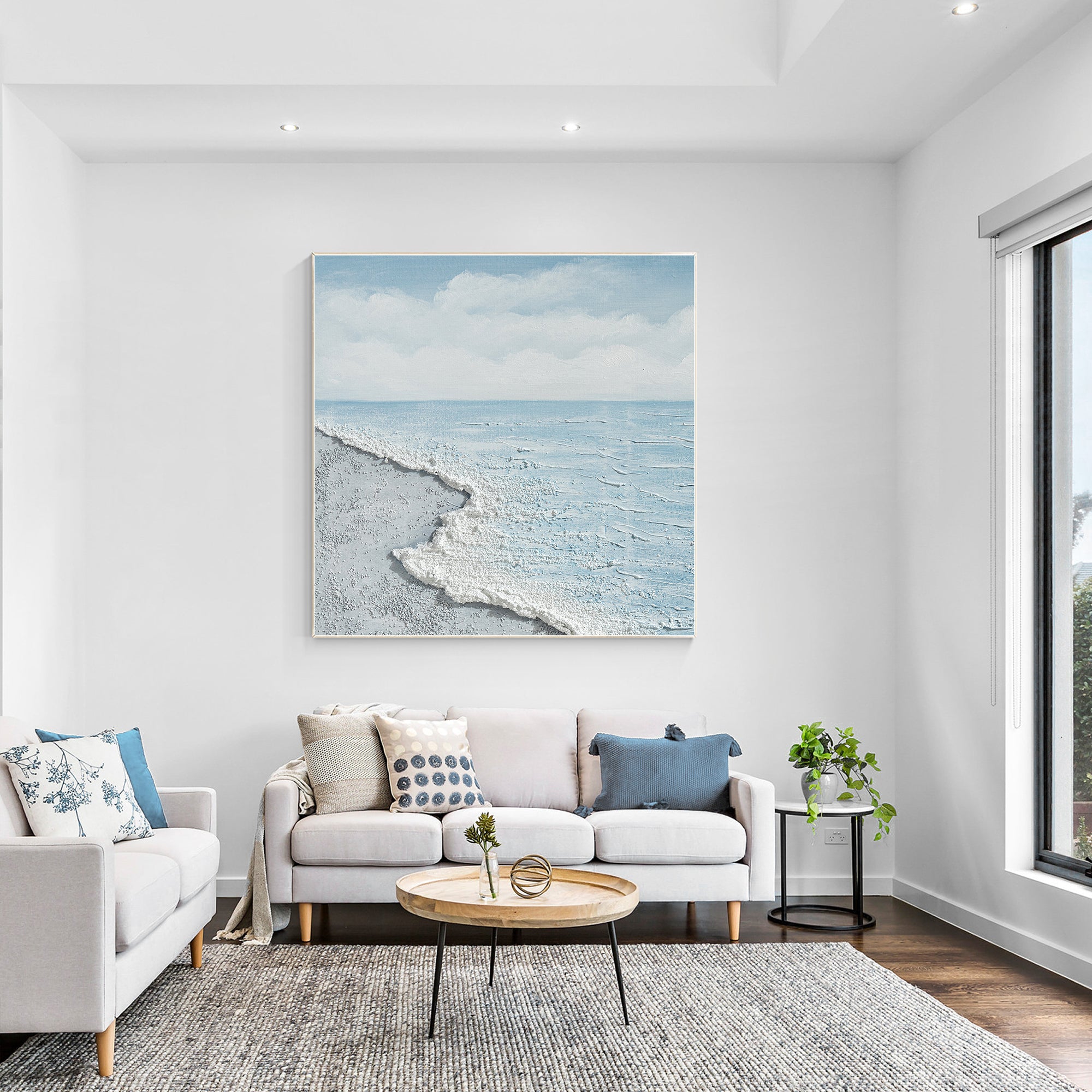 Square coastal wall art with light blue, gray, and white ocean design