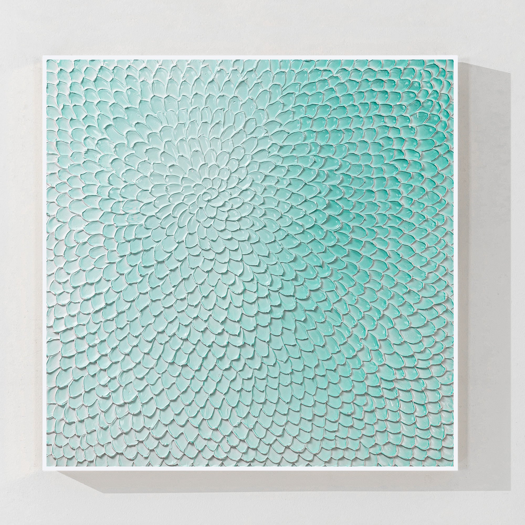 Teal green flower circle wall art with 3D plaster texture
