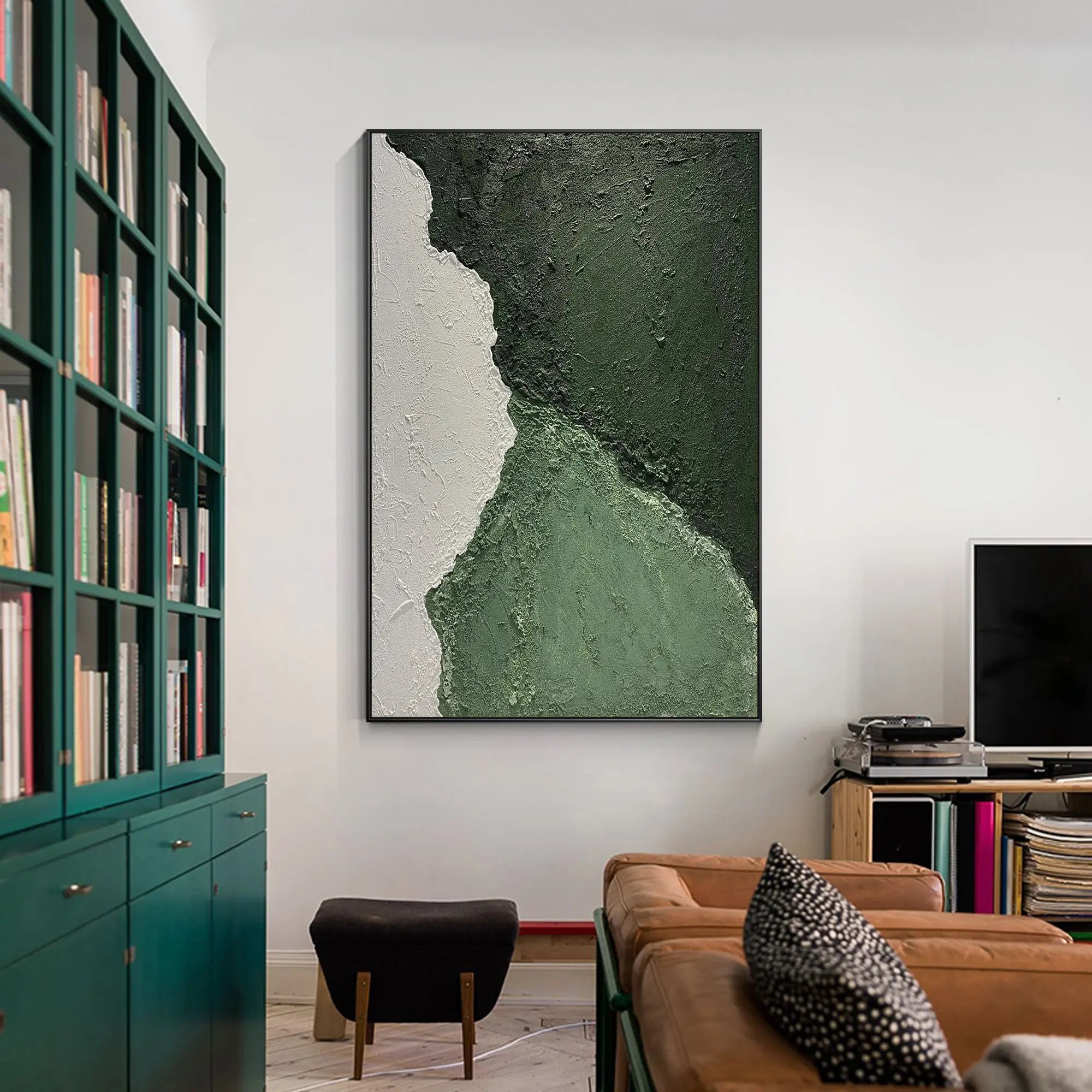 Living room wall decor featuring a textured emerald green abstract painting