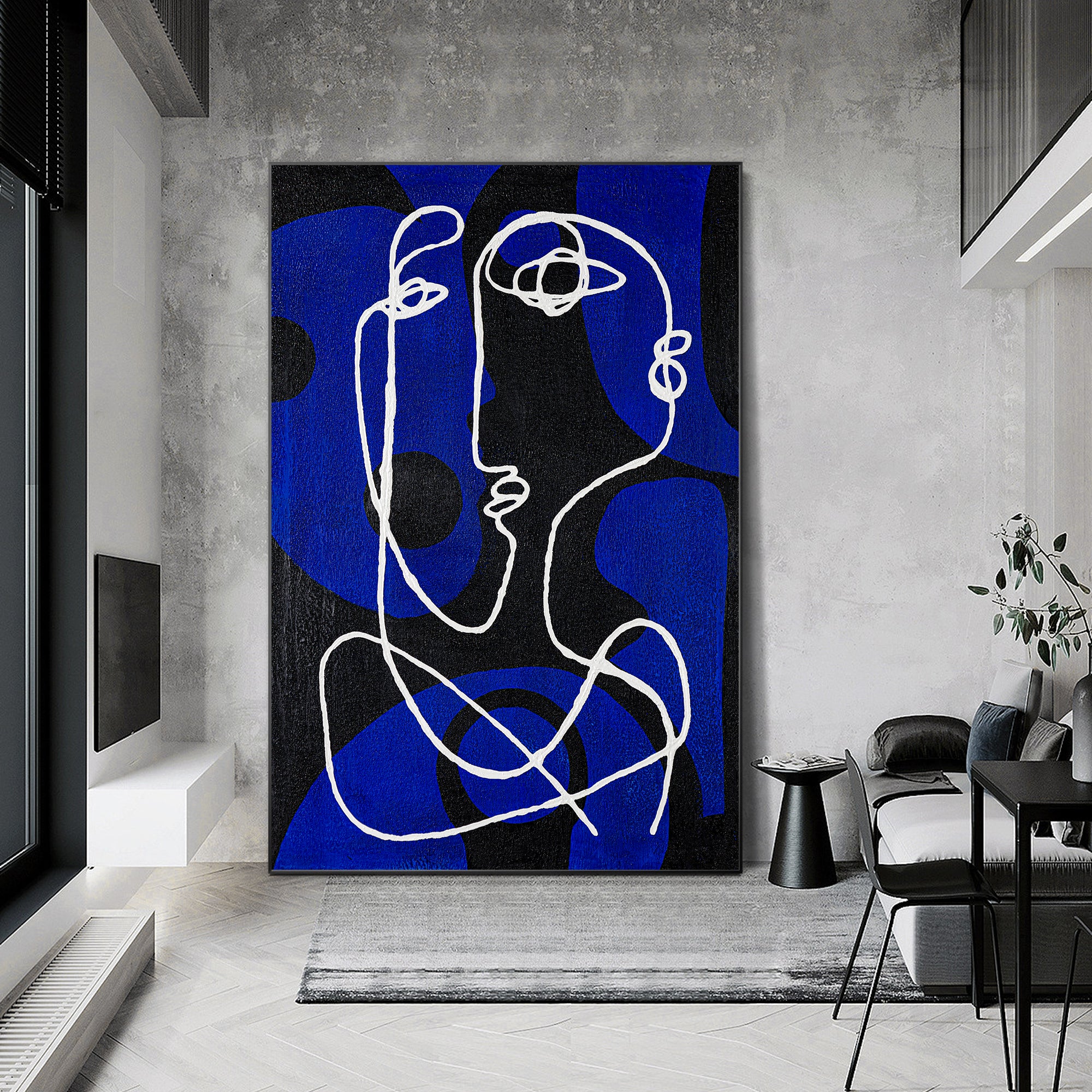 Large blue and black canvas artwork featuring minimalist white line figures