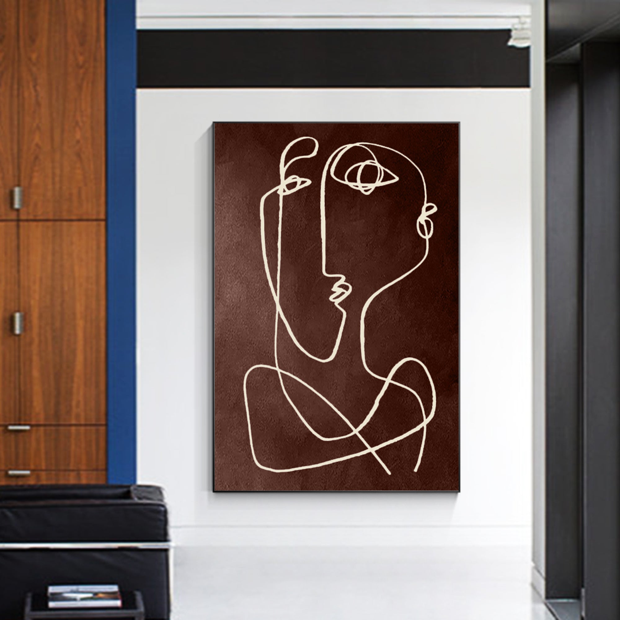 Large brown canvas artwork featuring minimalist, white line art