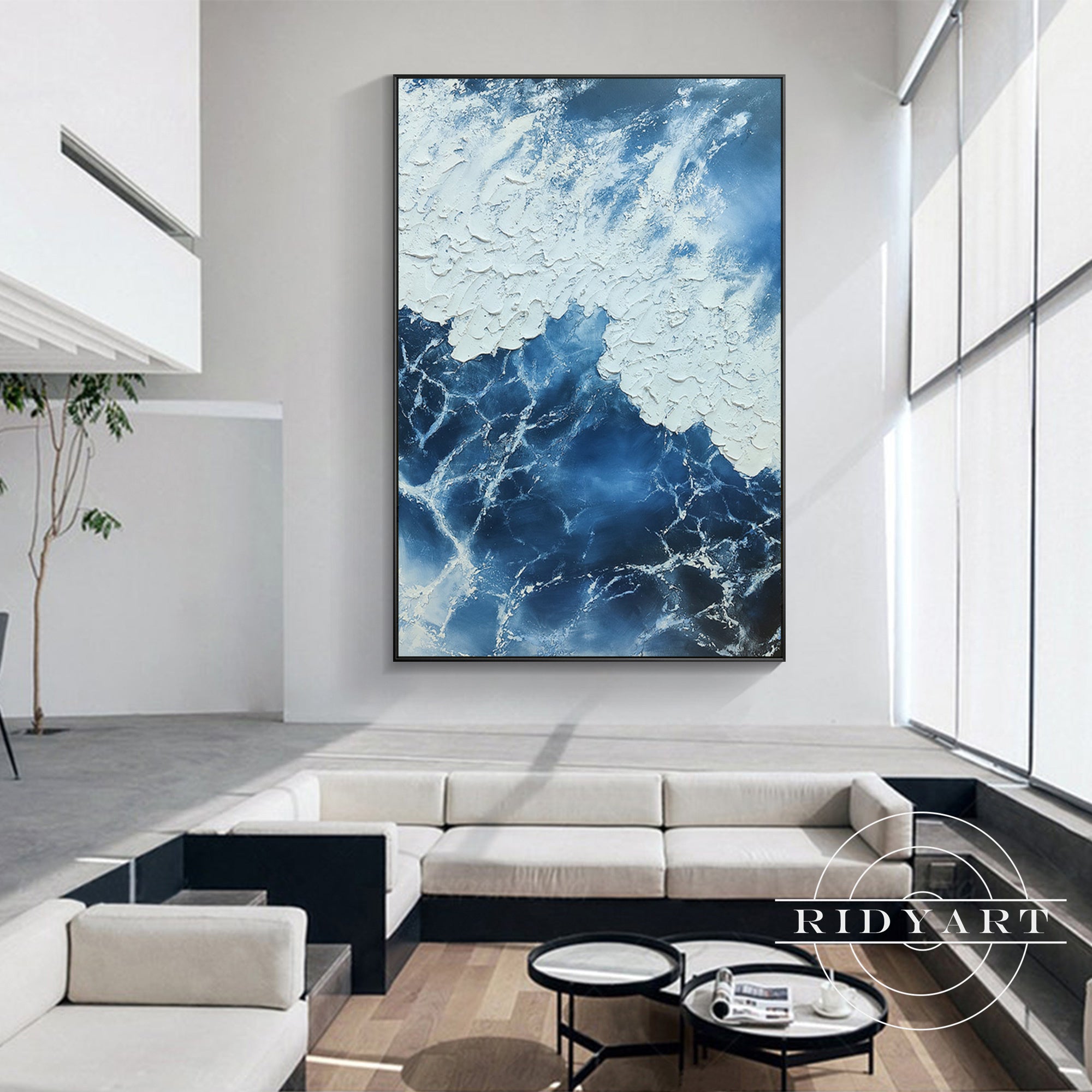 Modern ocean-inspired wall art with navy blue and textured white details.