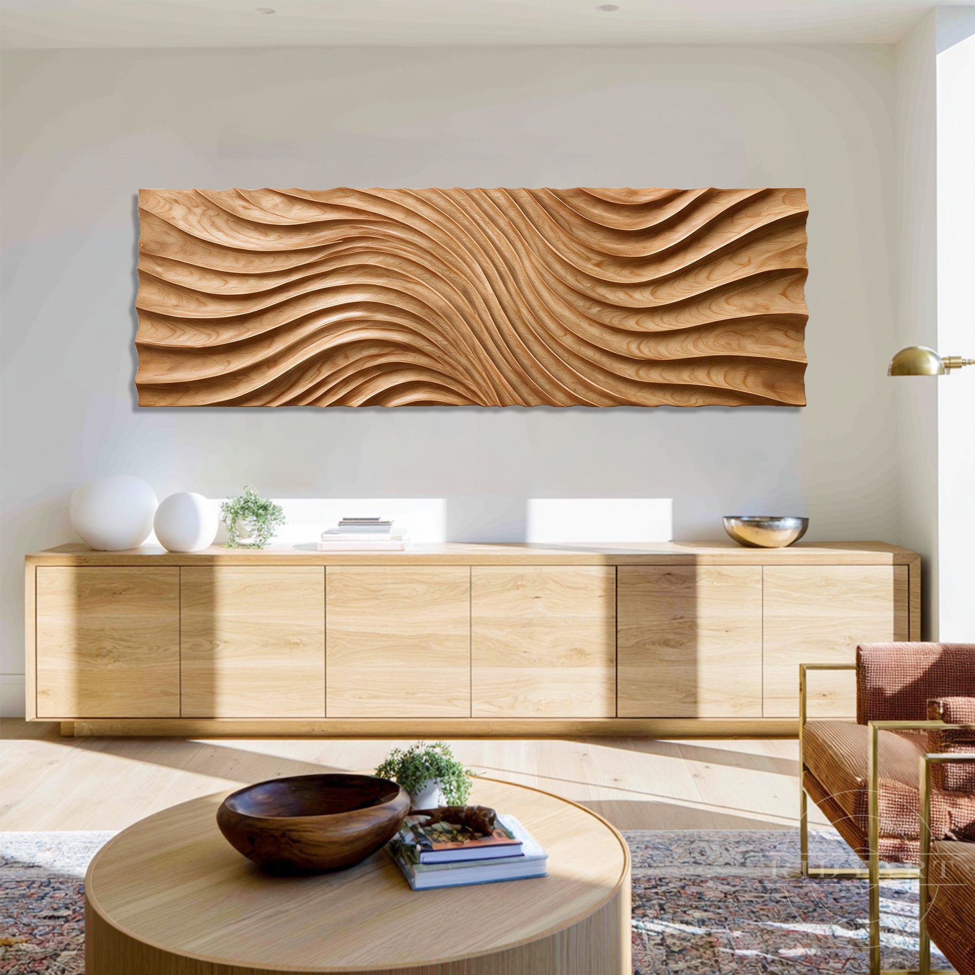 Wood wall art with wave patterns displayed on a white wall above a low wooden sideboard credenza.