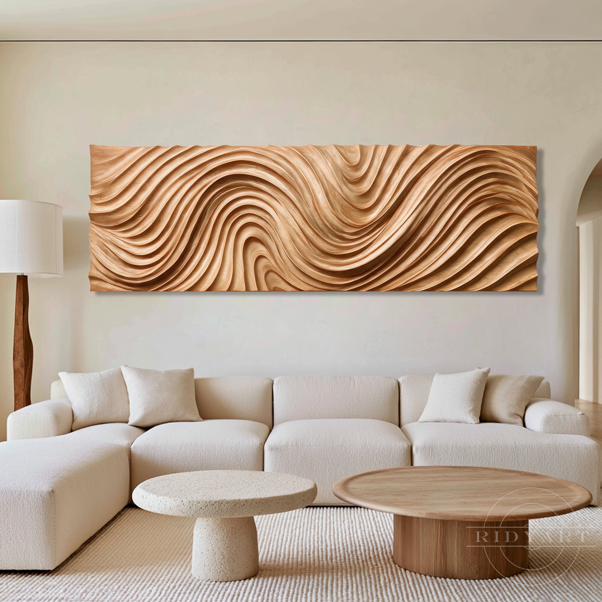 Minimalist luxury living room with a cream L-shaped sofa and marble coffee tables, featuring a large abstract terrain woodwall art above.