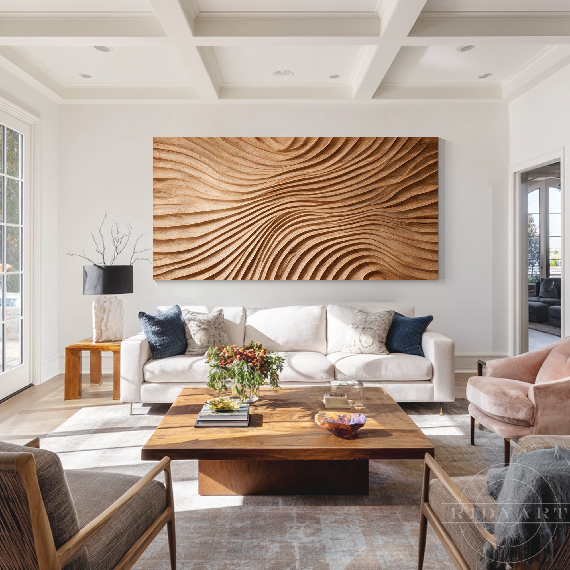 Panoramic wood wave wall art centered on a bright living room wall behind a cream sofa and rustic coffee table
