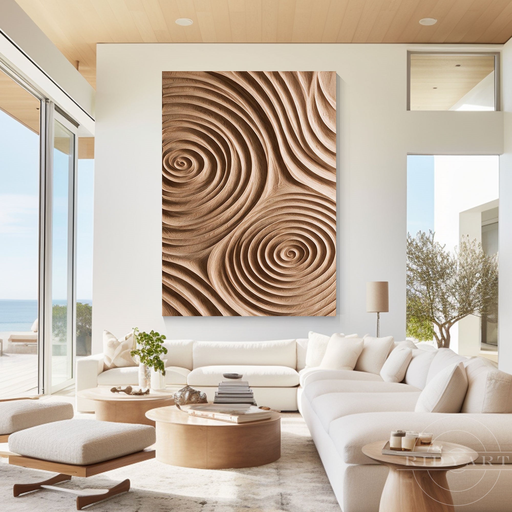 Oversized abstract swirl wood wall art in a open-concept coastal living room with a white sectional sofa