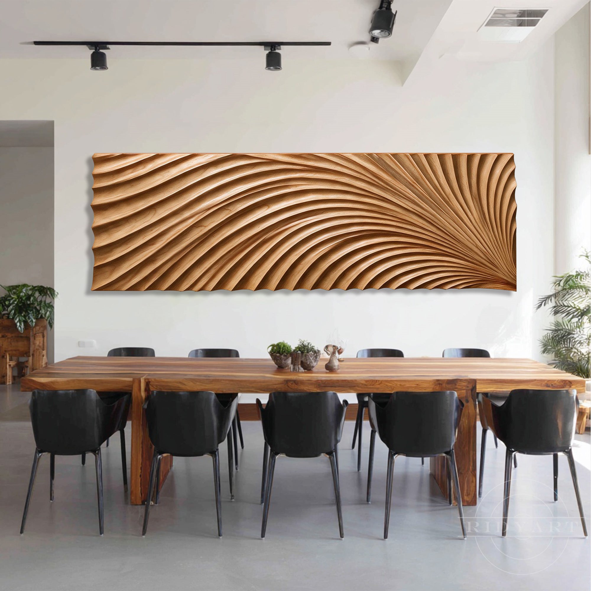 Large abstract feathers wood wall panel installed on a crisp white wall above a modern wooden dining set with black chairs.